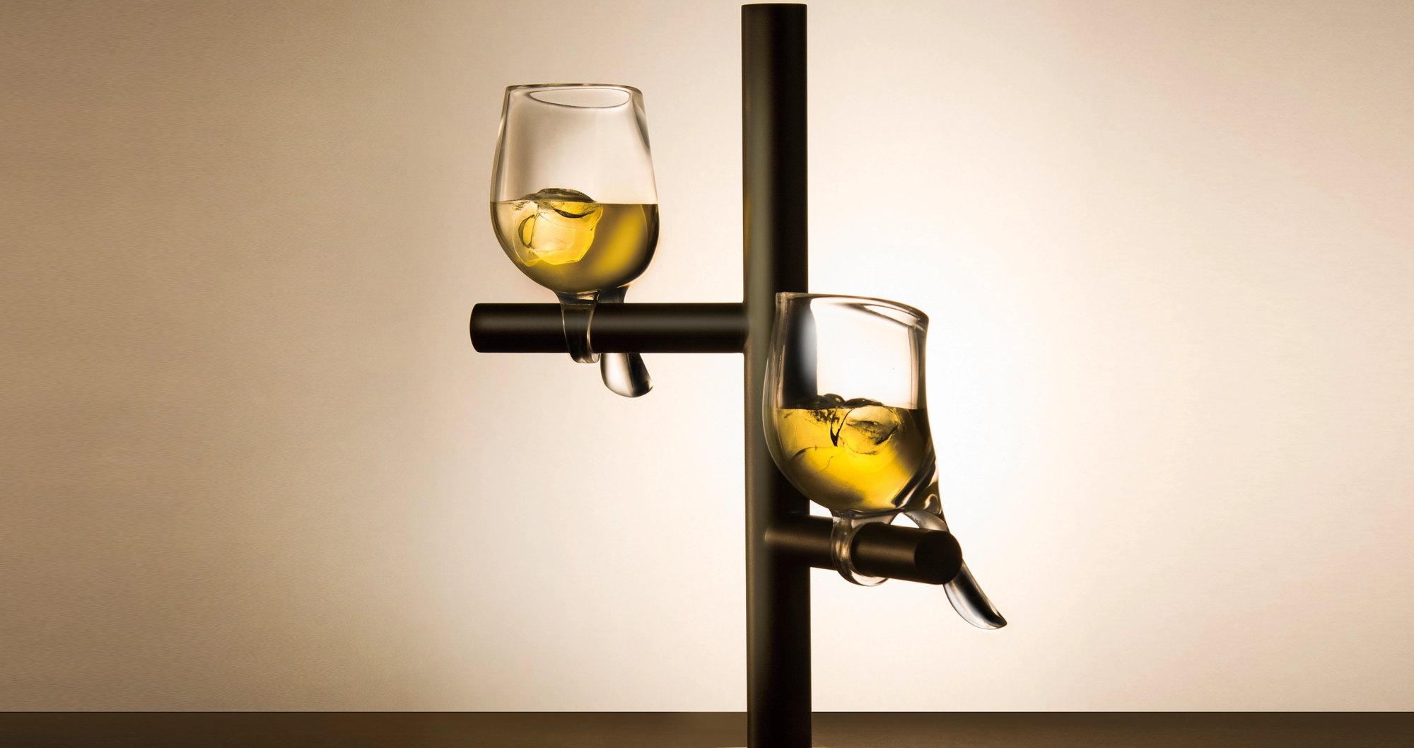 Birds Glass Design — glasses filled with whisky on the rack